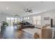 Spacious living room featuring hardwood floors, neutral tones, ceiling fan and dining table with natural light at 349 Long Pier St, Summerville, SC 29486