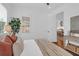 Bright bedroom with natural light, wood floors, and stylish decor, offering comfort and elegance at 4 Addison St, Charleston, SC 29403