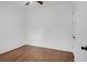 Empty bedroom features hardwood floors, ceiling fan, white walls, and a closet door at 4 Addison St, Charleston, SC 29403