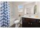 Cozy bathroom with a shower and tub combination, a sink and a dark wood vanity at 433 Thoroughbred Dr, Moncks Corner, SC 29461