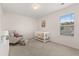 This Bedroom boasts a white crib, a gray chair, and a painting on the wall for a cozy and inviting space at 433 Thoroughbred Dr, Moncks Corner, SC 29461