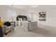 Bright bedroom features a comfortable bed, side tables with lamps, and a gray patterned chair at 433 Thoroughbred Dr, Moncks Corner, SC 29461