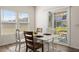 A sunlit dining area features sliding glass doors and seating for four at 433 Thoroughbred Dr, Moncks Corner, SC 29461