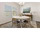 Bright dining area features a round table, updated chandelier, and large windows at 433 Thoroughbred Dr, Moncks Corner, SC 29461