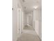 Upstairs hallway with neutral carpeting and white walls leading to bedrooms at 433 Thoroughbred Dr, Moncks Corner, SC 29461