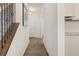 Welcoming hallway with neutral walls and wood-look floors lead into the entryway at 433 Thoroughbred Dr, Moncks Corner, SC 29461