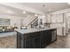 Spacious kitchen island with seating and a view into the living area at 433 Thoroughbred Dr, Moncks Corner, SC 29461