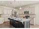 Bright kitchen features a large island with seating and modern appliances at 433 Thoroughbred Dr, Moncks Corner, SC 29461
