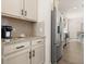 A modern kitchen features granite countertops, stainless steel appliances, and ample cabinet space at 433 Thoroughbred Dr, Moncks Corner, SC 29461