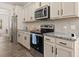 Well-equipped kitchen with granite countertops, stainless steel appliances, and ample cabinetry at 433 Thoroughbred Dr, Moncks Corner, SC 29461