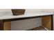 This is a laundry room counter with a woven basket, a brown frame, and a white and gray marbled top at 433 Thoroughbred Dr, Moncks Corner, SC 29461