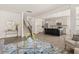 Open-concept living area with kitchen access and hardwood floors throughout at 433 Thoroughbred Dr, Moncks Corner, SC 29461