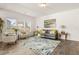 Inviting living room with natural light, stylish furniture, and hardwood floors at 433 Thoroughbred Dr, Moncks Corner, SC 29461