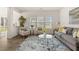 Comfortable living room with large windows, stylish decor, and a serene atmosphere at 433 Thoroughbred Dr, Moncks Corner, SC 29461