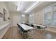 Bright activity room featuring tables, chairs, and ample natural light, great for gatherings at 440 Four Seasons Blvd, Summerville, SC 29486
