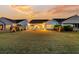 Spacious backyard with a patio, perfect for outdoor relaxation and entertaining under the evening sky at 440 Four Seasons Blvd, Summerville, SC 29486