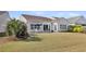 The backyard features a patio, table, chairs, green grass and a white fence that borders the property at 440 Four Seasons Blvd, Summerville, SC 29486