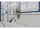 Luxurious bathroom features a soaking tub, glass shower, neutral tile, and lots of natural light at 440 Four Seasons Blvd, Summerville, SC 29486