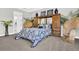 Comfortable bedroom boasts neutral walls, a large closet and natural light from the surrounding windows at 440 Four Seasons Blvd, Summerville, SC 29486