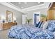 Primary bedroom features gray walls, tray ceiling, natural light, and an ensuite at 440 Four Seasons Blvd, Summerville, SC 29486
