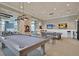 Billiards room with a pool table, modern lighting, and comfortable seating for entertainment at 440 Four Seasons Blvd, Summerville, SC 29486