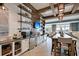 Stylish clubhouse kitchen with modern appliances, a long dining table, and ample seating at 440 Four Seasons Blvd, Summerville, SC 29486