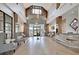 Spacious clubhouse lobby with high ceilings, elegant decor, and comfortable seating areas at 440 Four Seasons Blvd, Summerville, SC 29486