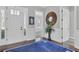 Elegant entryway with hardwood floors, white wainscoting, and a view into adjacent rooms at 440 Four Seasons Blvd, Summerville, SC 29486