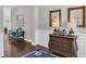 Inviting entryway with dark wood floors, wainscoting, and elegant decor at 440 Four Seasons Blvd, Summerville, SC 29486