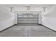 A two car garage featuring automatic door, painted walls and floors, and interior lighting at 440 Four Seasons Blvd, Summerville, SC 29486