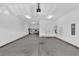 A spacious garage with bright lighting, lots of storage, and access to the inside of the home at 440 Four Seasons Blvd, Summerville, SC 29486
