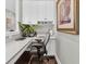 Functional home office with white cabinetry, quartz countertop, and hardwood floors at 440 Four Seasons Blvd, Summerville, SC 29486