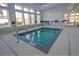 Indoor jacuzzi surrounded by windows with a metal railing and 'No Diving' signage at 440 Four Seasons Blvd, Summerville, SC 29486