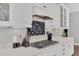 Close-up of kitchen with light-colored countertops, cabinetry, and modern appliances at 440 Four Seasons Blvd, Summerville, SC 29486