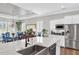 Open-concept kitchen featuring a large island with sink, pendant lighting and adjacent dining area with large windows at 440 Four Seasons Blvd, Summerville, SC 29486