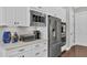 Updated kitchen featuring stainless steel appliances, white cabinets, and marble countertops at 440 Four Seasons Blvd, Summerville, SC 29486