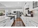 Bright, updated kitchen with stainless appliances, white cabinets, dark floors, and marble countertops at 440 Four Seasons Blvd, Summerville, SC 29486