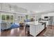 Open concept living space with a large kitchen island, hardwood floors, and ample natural light at 440 Four Seasons Blvd, Summerville, SC 29486