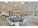 Banquet hall featuring tables and chairs with decorative chandeliers for community or party events at 440 Four Seasons Blvd, Summerville, SC 29486