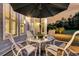 Relaxing patio with an umbrella-covered table, perfect for outdoor dining and enjoying the evening sunset at 440 Four Seasons Blvd, Summerville, SC 29486