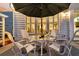 Charming patio area featuring an umbrella-covered table and chairs, ideal for enjoying the outdoors at 440 Four Seasons Blvd, Summerville, SC 29486