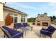 Outdoor brick patio featuring ample seating and an outdoor fireplace for entertaining at 440 Four Seasons Blvd, Summerville, SC 29486