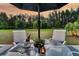 This house has a perfect patio for relaxation, featuring a table and chairs with a wine bottle at 440 Four Seasons Blvd, Summerville, SC 29486