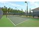 Well-maintained tennis court ready for a match, surrounded by lush greenery at 440 Four Seasons Blvd, Summerville, SC 29486