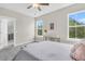 Light-filled bedroom with large windows, a plush bed, and tasteful decor creating a tranquil oasis at 4429 Avery Ave, North Charleston, SC 29405