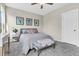 Comfortable bedroom with soft grey decor, plush pillows, and ample natural light for a peaceful retreat at 4429 Avery Ave, North Charleston, SC 29405