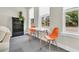 Versatile bonus room with natural light, a table, and a bookshelf offers flexible space for various activities at 4429 Avery Ave, North Charleston, SC 29405