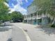 Charming commercial building with outdoor seating, manicured trees, and easy access to the street at 4429 Avery Ave, North Charleston, SC 29405