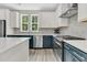 Well-equipped kitchen with stainless steel appliances, ample counter space, and stylish two-tone cabinetry at 4429 Avery Ave, North Charleston, SC 29405