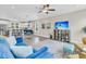 Spacious living room featuring modern furnishings, sleek ceiling fan, and an open floor plan at 4429 Avery Ave, North Charleston, SC 29405